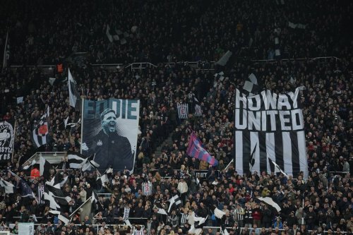 Fans hola a poster of Newcastle's head coach Eddie Howe during a Premier League soccer match between Newcastle United and Manchester City in Newcastle, England, Saturday, Nov. 22, 2025. (AP Photo/Jon Super)