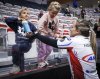Team Homan skip Rachel Homan celebrates with her children after defeating Team Brown in the women's final at the PointsBet Invitational in Calgary, Sunday, Oct. 5, 2025. THE CANADIAN PRESS/Jeff McIntosh