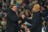Leeds' head coach Daniel Farke, left, greets Manchester City's head coach Pep Guardiola after the English Premier League soccer match between Manchester City and Leeds United in Manchester, England, Saturday, Nov. 29, 2025. (AP Photo/Ian Hodgson)