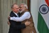 FILE - Indian Prime Minister Narendra Modi, right, hugs Russian President Vladimir Putin before their meeting in New Delhi, India, on Oct. 5, 2018. (AP Photo/Manish Swarup, File)