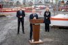 Prime Minister Mark Carney speaks as Minister of Housing and Infrastructure Gregor Robertson, left, and Chief Executive Officer of the federal Major Projects Office, Dawn Farrell, right, listen during a major projects announcement in Terrace, B.C., on Thursday, Nov. 13, 2025. THE CANADIAN PRESS/Ethan Cairns