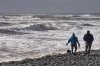 Hikers walk along Lawrencetown Beach Provincial Park, in Lawrencetown, N.S., Sunday, Jan. 14, 2024. THE CANADIAN PRESS/Darren Calabrese