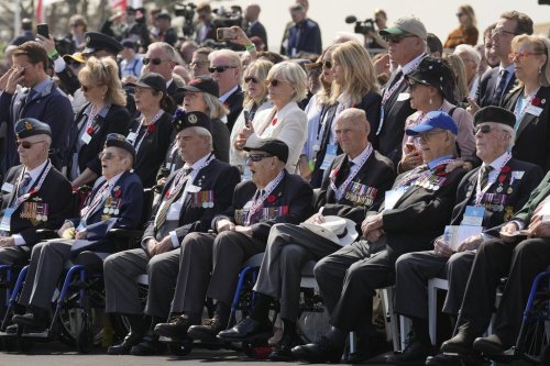 Canadian veterans, the oldest of them 104 years old, attend a ceremony to mark the 80th anniversary of D-Day, at Juno Beach in Courseulles-sur-Mer, Normandy, France, Thursday, June 6, 2024. THE CANADIAN PRESS/Adrian Wyld