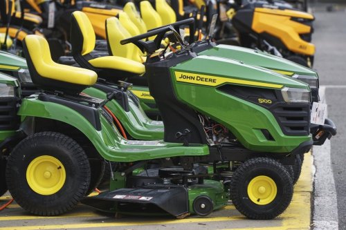 John Deere lawn tractors sit on display outside a Home Depot in Robinson Township, Pa., Friday, April 11, 2025. A video claiming the farm equipment giant was moving its factories from Canada to the United States misled some social media users this week. John Deere hasn't had a manufacturing facility in Canada since 2009. THE CANADIAN PRESS/AP-Gene J. Puskar