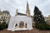 A Nativity scene containing characters with cloth faces, by Belgian artist Victoria-Maria Geyer, is displayed in a white tent in Brussels, Monday, Dec. 1, 2025. (AP Photo/Sylvain Plazy)