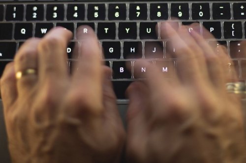 A man uses a computer keyboard in Toronto in a Sunday, Oct. 9 photo illustration. THE CANADIAN PRESS/Graeme Roy
