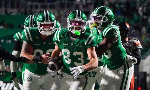 Saskatchewan Roughriders receiver Tommy Nield (83) celebrates with teammates after scoring a touchdown against the B.C. Lions during the second half of CFL West Division final football action in Regina, on Saturday, November 8, 2025. THE CANADIAN PRESS/Heywood Yu