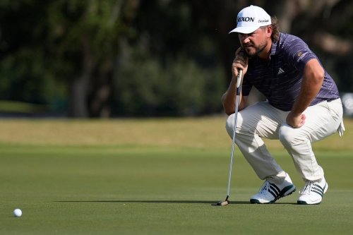 Andrew Novak lines up a putt on the nineth green during the second round of the RSM Classic golf tournament, Friday, Nov. 21, 2025, in St. Simons Island, Ga. (AP Photo/Mike Stewart)