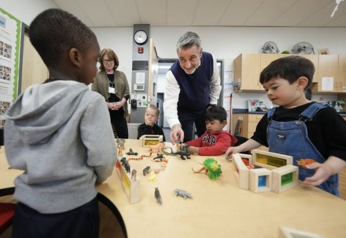 Ontario Minister of Education Paul Calandra, centre, visits children at the Blessed Chiara Badano Child Care Centre in Stouffville, Ont., Friday, May 2, 2025. THE CANADIAN PRESS/Nathan Denette