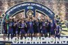 PSG's Marquinhos lifts the trophy after winning the FIFA Intercontinental Cup final soccer match between Flamengo and Paris Saint-Germain in Doha, Qatar, Wednesday, Dec. 17, 2025. (AP Photo/Hussein Sayed)