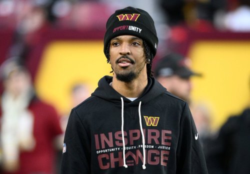 Injured Washington Commanders quarterback Jayden Daniels looks on before an NFL football game against the Philadelphia Eagles, Saturday, Dec. 20, 2025, in Landover, Md. (AP Photo/Nick Wass)