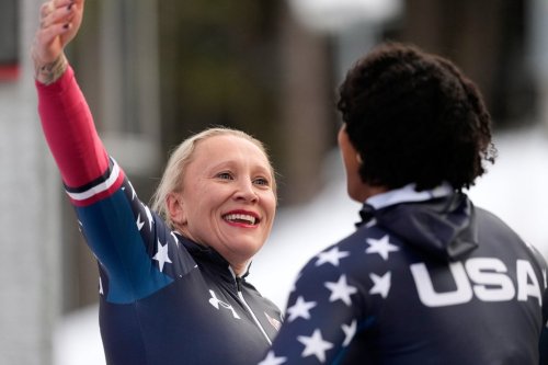 Kaillie Armbruster Humphries, left, and Jasmine Jones, of the United States, react after their second run of the 2-woman bobsleigh race at the Bobsleigh World Cup in Innsbruck, Austria, Sunday, Nov. 30, 2025. (AP Photo/Matthias Schrader)