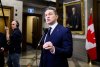 Leader of the Conservative Party Pierre Poilievre speaks in the Foyer of the House of Commons on Thursday, Dec. 11, 2025. THE CANADIAN PRESS/Spencer Colby