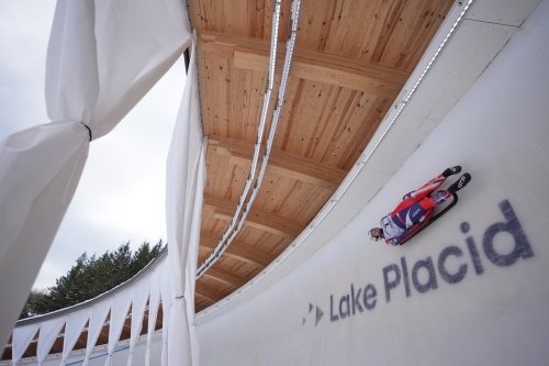 John Eric Gustafson participates in a qualifying race for a Luge World Cup event in Lake Placid, N.Y., Thursday, Dec. 18, 2025. (AP Photo/Seth Wenig)