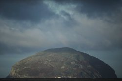 The island of Ailsa Craig, where the two types of granite, Common Green and Blue Hone, that are used to make curling stones is quarried from, is seen from the beach at Girvan, Scotland, Thursday, Nov. 13, 2025. (AP Photo/Alastair Grant)