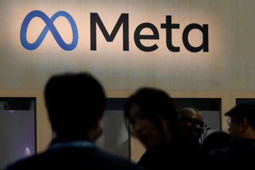 FILE - Attendees visit the Meta booth at the Game Developers Conference 2023 in San Francisco on March 22, 2023. (AP Photo/Jeff Chiu, File)