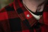 The Order of Canada pin is seen on the lapel of Canadian journalist and musician, Nardwuar the Human Serviette at Neptune Records in Vancouver, on Monday, Dec. 29, 2025. THE CANADIAN PRESS/Ethan Cairns