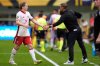 Canada forward Jacob Shaffelburg (14) acknowledges head coach Jesse Marsch, right, while leaving the field after receiving a red card during the first half of a CONCACAF Gold Cup quarterfinals soccer match against Guatemala, Sunday, June 29, 2025, in Minneapolis. (AP Photo/Abbie Parr)
