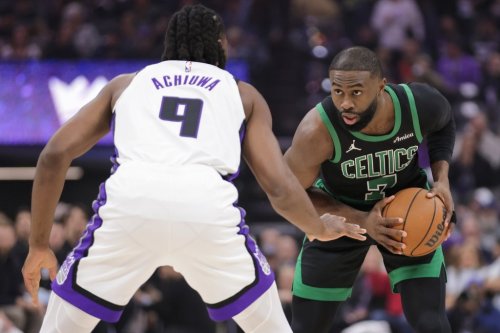 Boston Celtics guard Jaylen Brown (7) is guarded by Sacramento Kings forward Precious Achiuwa (9) during the first half of an NBA basketball game Thursday, Jan. 1, 2026, in Sacramento, Calif. (AP Photo/Scott Marshall)
