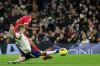 Liverpool's Alexander Isak, top, scores the opening goal during the English Premier League soccer match between Tottenham and Liverpool in London, Saturday, Dec. 20, 2025. (AP Photo/Ian Walton)