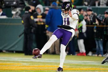 Baltimore Ravens punter Jordan Stout (11) warms up before an NFL football game against the Green Bay Packers, Saturday, Dec. 27, 2025, in Green Bay, Wis. (AP Photo/Morry Gash)