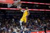 Los Angeles Lakers forward LeBron James (23) breaks free for a dunk against the New Orleans Pelicans during the second half of an NBA basketball game in New Orleans, Tuesday, Jan. 6, 2026. (AP Photo/Matthew Hinton)
