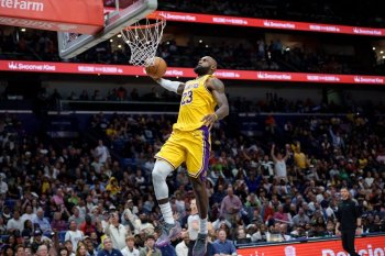 Los Angeles Lakers forward LeBron James (23) breaks free for a dunk against the New Orleans Pelicans during the second half of an NBA basketball game in New Orleans, Tuesday, Jan. 6, 2026. (AP Photo/Matthew Hinton)