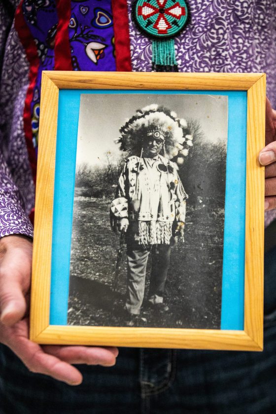 Randy Merrick holds a photo of his great-grandfather, Chief Frank Merrick, after the repatriation ceremony. (Mikaela MacKenzie / Free Press)