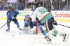 New York Sirens' Kristyna Kaltounkova, front, brings the puck around the net to shoot at Toronto Sceptres goaltender Elaine Chuli, second left, during first period PWHL hockey action, in Toronto, on Tuesday Jan. 6, 2026. THE CANADIAN PRESS/Chris Young
