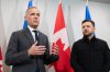 Prime Minister Mark Carney, left, and Ukrainian President Volodymyr Zelenskyy hold a press conference in Halifax, N.S. on Saturday, Dec. 27, 2025. THE CANADIAN PRESS/Riley Smith