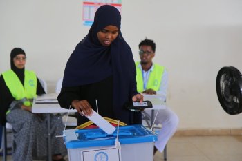 A woman casts her vote during the local election in Mogadishu, Somalia, Thursday, Dec. 25, 2025. (AP Photo/Farah Abdi Warsameh)
