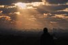 A Palestinian looks over an area of buildings destroyed during Israeli air and ground operations at sunset in northern Nuseirat, central Gaza Strip, Friday, Dec. 19, 2025. (AP Photo/Abdel Kareem Hana)