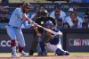 FILE - Philadelphia Phillies' Kyle Schwarber connects for a double during the first inning in Game 4 of baseball's National League Division Series against the Los Angeles Dodgers, Oct. 9, 2025, in Los Angeles. (AP Photo/Jae C. Hong, File)