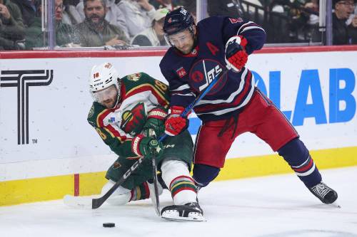 Matt Krohn / THE ASSOCIATED PRESS FILES
                                Winnipeg Jets defenceman Neal Pionk (right) was injured Nov. 23 against the Minnesota Wild, leaving in the first period with a lower-body injury.