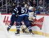 John Woods / THE CANADIAN PRESS
                                Winnipeg Jets’ Cole Koepke (left hidden) collides with Buffalo Sabres’ Beck Malenstyn (29) as Elias Salomonsson (57) looks on during first period NHL action in Winnipeg on Friday, December 5, 2025.