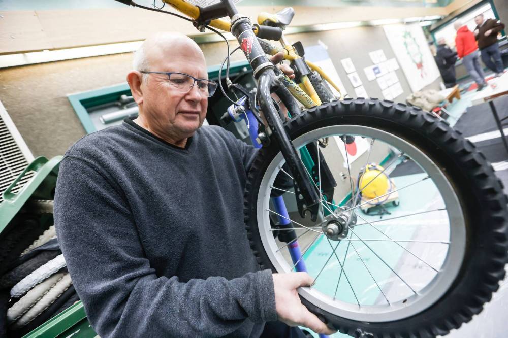 JOHN WOODS / FREE PRESS
Gerry Hagglund was one of more than 100 volunteers who participated in the WRENCH’s 15th annual Cycle of Giving on Sunday.