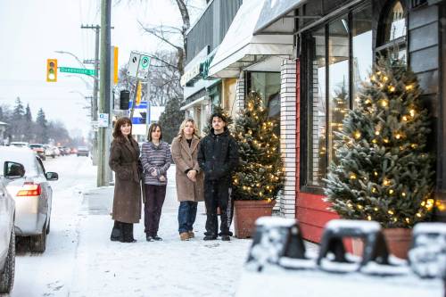 MIKAELA MACKENZIE / FREE PRESS Laurel Penner, owner of Salt Living (left), Sylvie Lobreau, daughter of the owner of the European Shoe Shop, Karleigh Evans, owner of Maggie Grace Boutique, and Santino Tesoro, owner of Central Barber Shop Canada, in front of their shops on Academy on Monday.