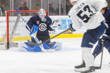 MIKE DEAL / FREE PRESS FILES
                                Dominic DiVincentiis (left) makes a save during training camp. The Manitoba Moose goaltender was called up the Winnipeg Jets Monday while Thomas Milic was sent back to the AHL club.