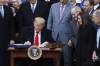 Bloomberg photo by Andrew Harrer
                                U.S. President Donald Trump signs the Canada-United States-Mexico Agreement on the South Lawn of the White House in Washington on Jan. 29, 2020. It&rsquo;s a deal Trump is now talking about abandoning.