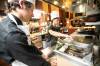 MIKAELA MACKENZIE / FREE PRESS
                                Grade 11 St. Johnճ High School students Stanley Armamento (right) and Logan McCowan deep fry spring rolls while preparing food for the Culinary Connections Program finale banquet at RRC Polytech on Thursday, Dec. 11, 2025. For Maggie story. Free Press 2025