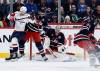 JOHN WOODS / THE CANADIAN PRESS
                                Winnipeg Jets goaltender Connor Hellebuyck (37) saves a shot as Luke Schenn (5) defends against Washington Capitals’ Brandon Duhaime (left) during the second period in Winnipeg on Saturday.