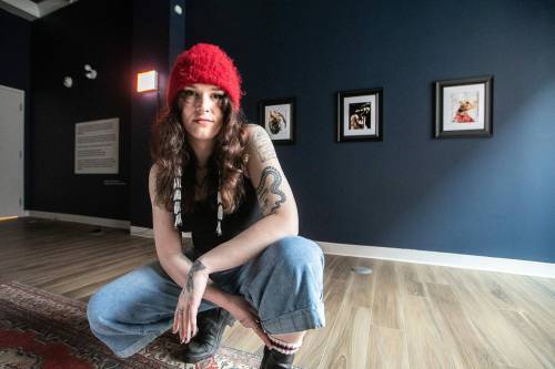 MIKAELA MACKENZIE / FREE PRESS files
                                Bria Fernandes with her show, Things Left Unsaid, at Gallery 1C03