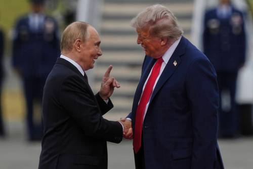 U.S. President Donald Trump greets Russia&rsquo;s President Vladimir Putin in August at Joint Base Elmendorf-Richardson, Alaska. (Julia Demaree Nikhinson / The Associated Press files)