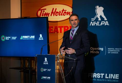 Chris Tanouye / NHLPA
                                Jay Harrison speaks at the First Line NHLPA Health and Wellness Press Conference in 2024.