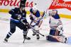 Fred Greenslade / THE CANADIAN PRESS
                                Oilers goaltender Calvin Pickard (right) makes a save while Jets&rsquo; centre Morgan Barron (left) and the Oilers&rsquo; Spencer Stastney look for a rebound Monday night in Winnipeg.