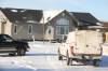 An RCMP vehicle sits outside a home at Sioux Valley Dakota Nation on Wednesday connected to a killing at another nearby home early Tuesday. (Tim Smith/The Brandon Sun)