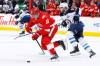 Detroit Red Wings centre Andrew Copp (18) is pursued up the ice by Winnipeg Jets centre Cole Perfetti (91) during the third period of Wednesday&rsquo;s game in Detroit. (Duane Burleson / The Associated Press)