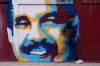 A pedestrian walks past a mural of Venezuelan President Nicolas Maduro in Caracas, Venezuela, on Sunday, Jan. 4, 2026. (AP Photo/Matias Delacroix)