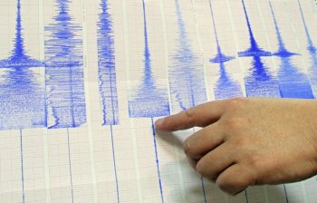 Director of Taiwan Seismology department at the Central Weather Bureau, Ku Kai-wen, points to Richter scale graphs after a strong earthquake hit southern Taiwan, Thursday, march 4, 2010, in Taipei, Taiwan. THE CANADIAN PRESS/AP Photo