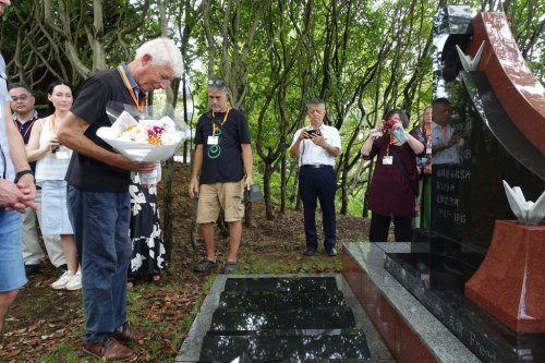 Relatives of former Dutch POWs pay tribute at a monument dedicated to the victims of prison abuse and the atomic bombing of Nagasaki 80 years ago as captives at the Fukuoka No. 14 Camp, at a ceremony, in Nagasaki, western Japan, Friday, Sept. 12, 2025. (AP Photo/Mari Yamaguchi)